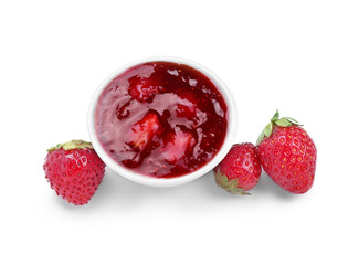 Bowl with delicious strawberry jam on white background
