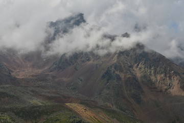 Fototapeta premium summit rock in the clouds high mountains of south tyrol italy europe