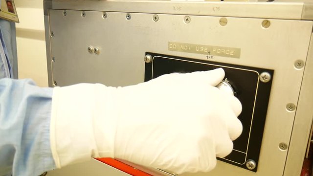 The hands of a scientist handling a centrifuge, a text saying, do not use force.