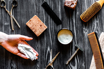 Tools for cutting beard barbershop top view on wooden background