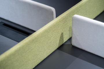 Dark table with green and gray textured partitions