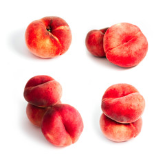 Saturn Peach isolated on white background. A set of flat peaches. Tree doughnut peaches in a pile.