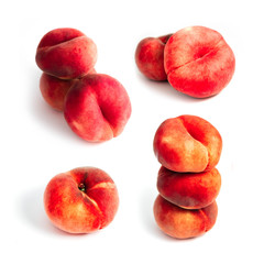Saturn Peach isolated on white background. A set of flat peaches. Tree doughnut peaches in a pile.