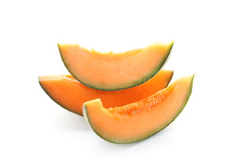 Slices of ripe melon on white background