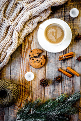 Christmas evening with cup of cocoa wooden background top view