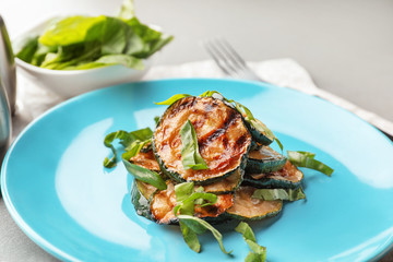 Tasty grilled zucchini on plate, closeup