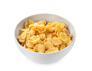 Bowl with healthy cornflakes on white background