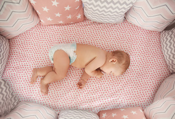 Cute little baby sleeping in crib