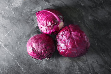 Ripe red cabbage on grey table