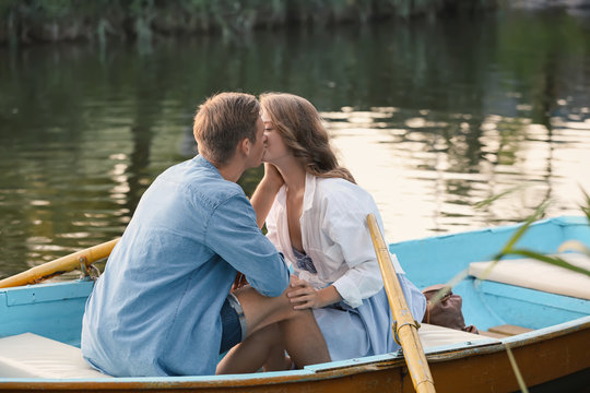 Cute Young Couple Having Romantic Date In Boat