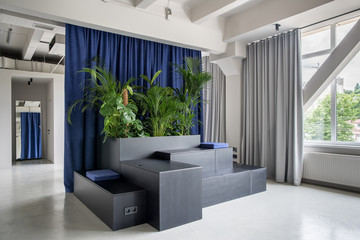 Stylish interior in loft style with gray walls