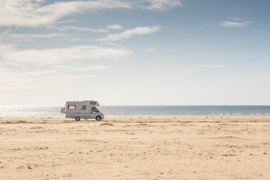 Campervan Parked On The Beach