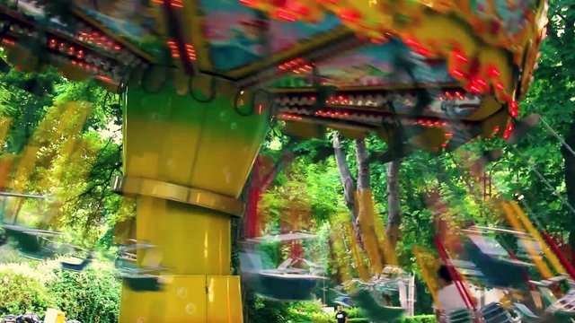 Kids on a swing ride in an amusement park