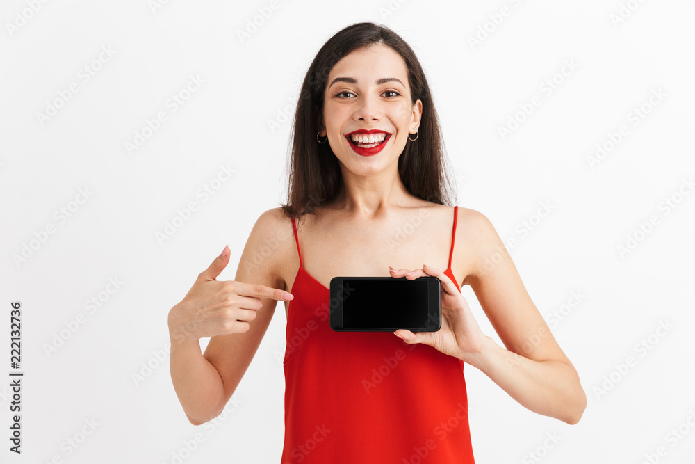 Wall mural Portrait of a happy young woman in dress