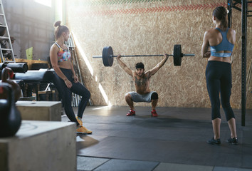 Sport. Crossfit Athletes At Workout Gym