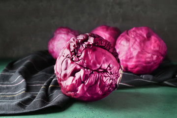 Fresh red cabbage on color table