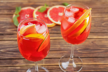 Fresh summer cocktail in glasses on wooden table