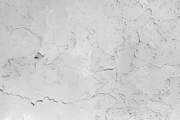 Old light gray concrete wall with cracks