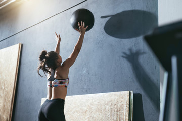 Workout. Sport Woman Training With Crossfit Ball At Gym
