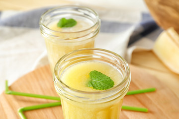 Glass jar with delicious melon smoothie, closeup