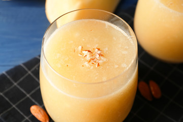 Glass with delicious melon smoothie, closeup