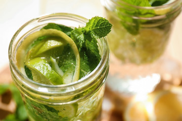 Jar of fresh mojito on table, closeup