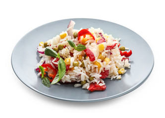 Plate with tasty boiled rice and vegetables on white background