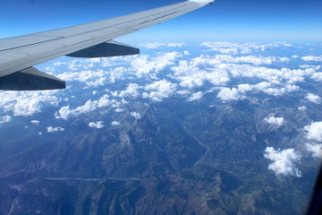 Fototapeta na wymiar Airplane window landscape, overflying Europe