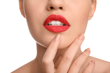 Obraz premium Beautiful young woman with bright red lipstick on white background, closeup