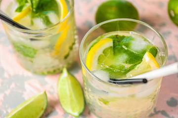 Glasses of fresh mojito on table, closeup