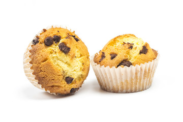 The tasty muffins with chocolate isolated on white background.