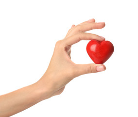 Female hand with red heart on white background