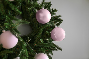 Fototapeta na wymiar Christmas wreath on light background