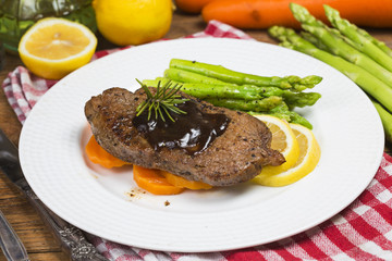 Fried steak, asparagus