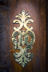 Metal decoration on the door of a Catholic Church.