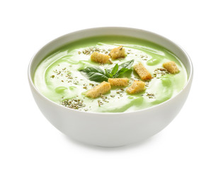 Bowl with delicious zucchini soup on white background