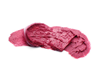 Stroke of color lipstick on white background