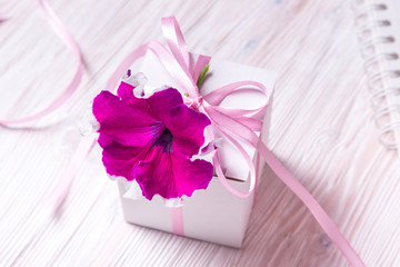 White carton gift box with flower