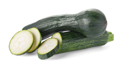 Ripe zucchinis on white background
