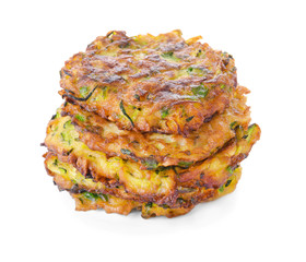 Tasty zucchini pancakes on white background