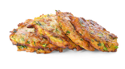 Tasty zucchini pancakes on white background