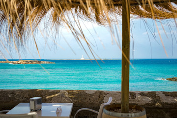 View of the sea of Sardinia by a restaurant.