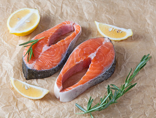 Raw salmon steak slices with spices and vegetables. Composition. Selective focus.