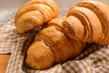 Tasty croissants on table, closeup