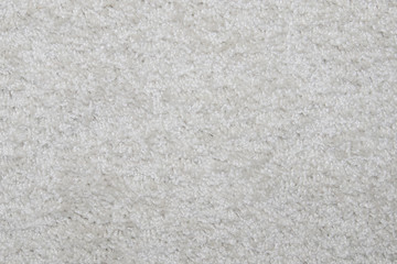 White synthetic short-napped floor carpet covering, may be used as background or texture