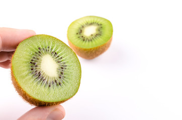 Man holding sliced kiwi