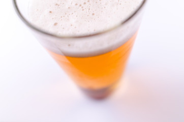 Beer glass full of foam