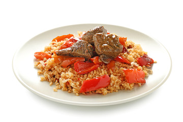 Plate with boiled rice, meat and sweet pepper on white background