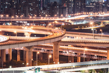 Fototapeta na wymiar Car Light Trails of New Taipei Bridge - Busy Taipei bridge after working hours