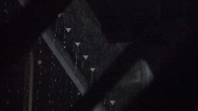 SLOW MOTION : Raindrop falling from roof